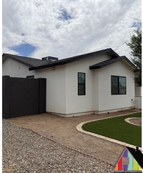 Freshly painted home exterior with new landscaping
