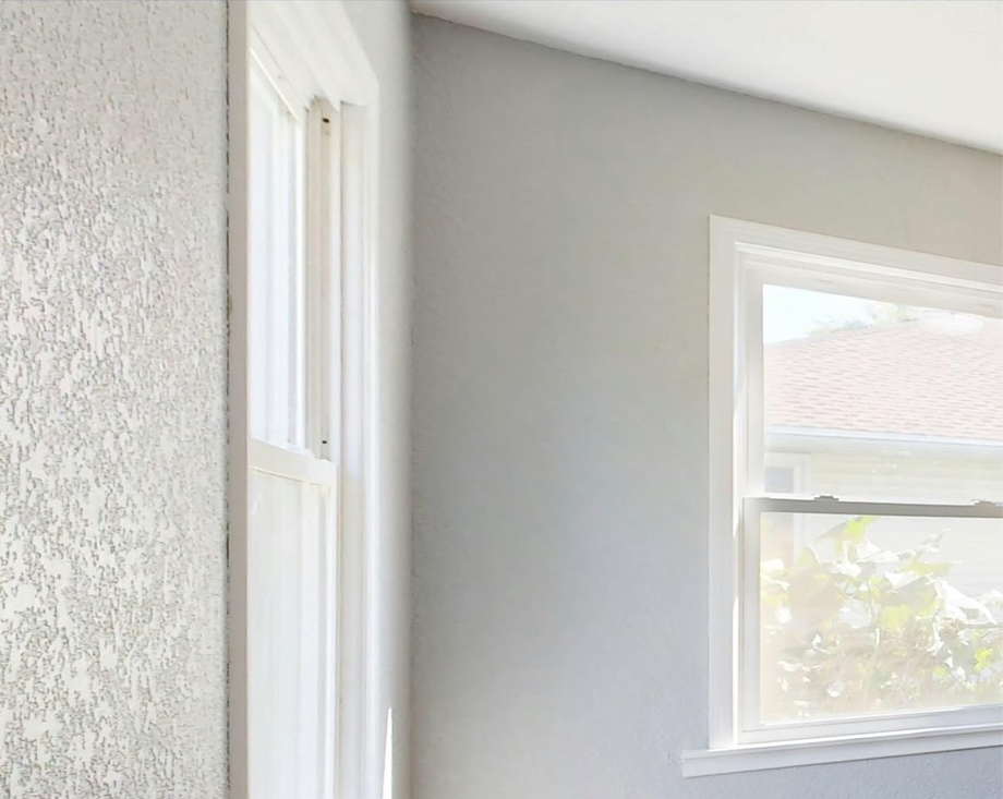 Freshly painted interior room with smooth walls and wood floors